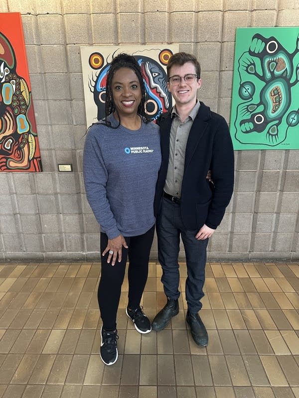 Two people pose for a photo
