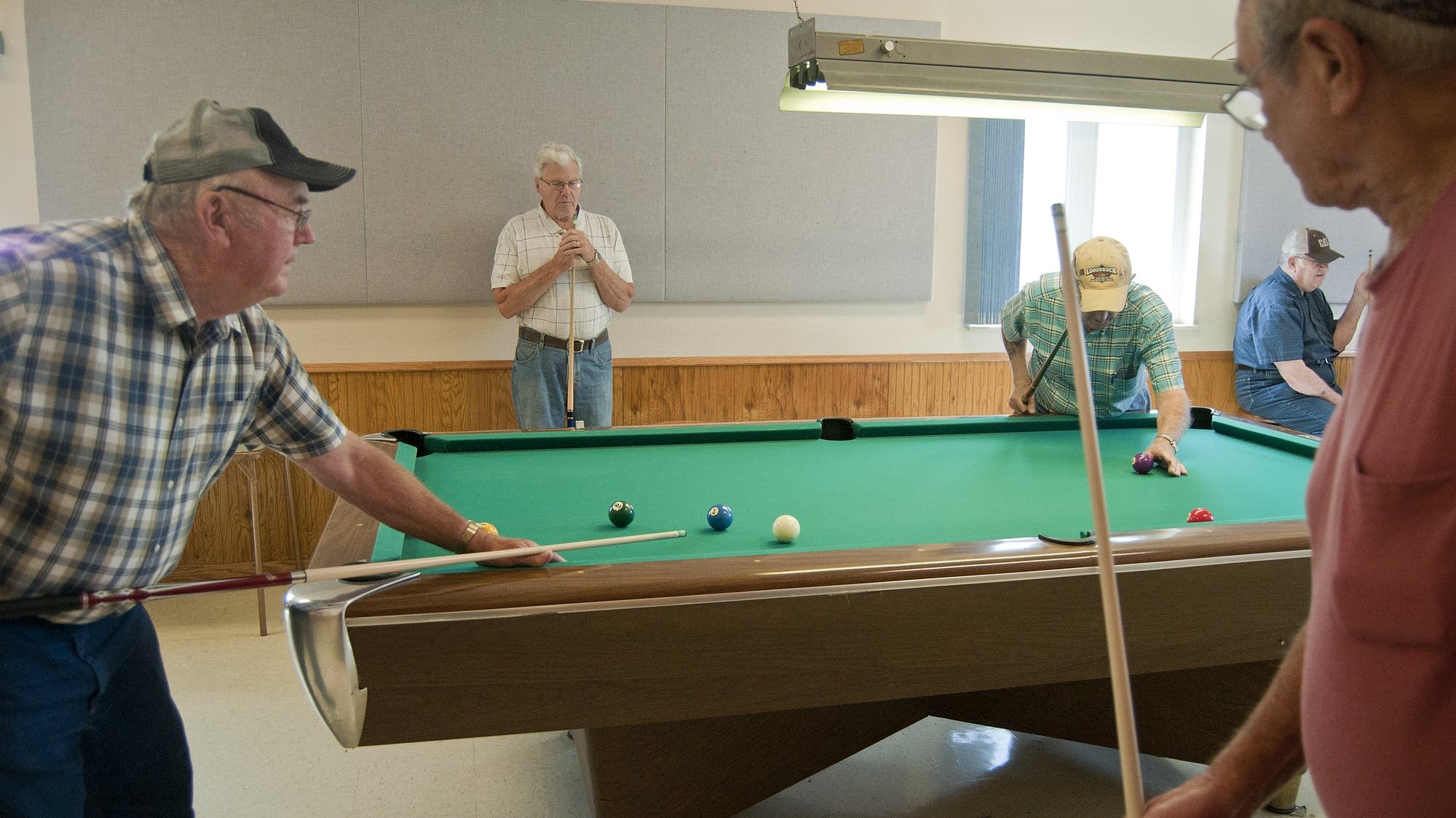 Playing pool in Wilmont's community center.