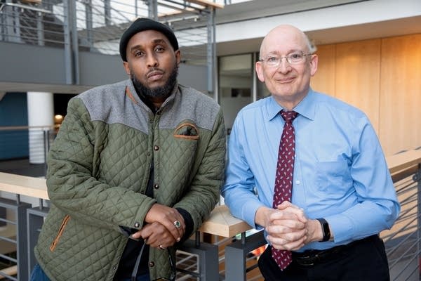 two men posing for a portrait