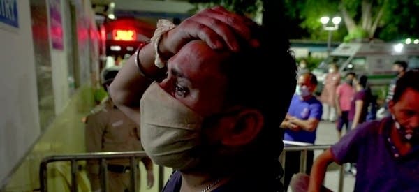 A record COVID surge in India is putting pressure on hospital beds and oxygen supplies.