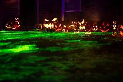 Lasers and carved pumpkins as part of a Halloween display