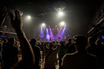 Crowd cheering watching performance on stage