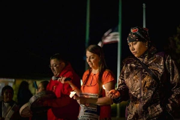 A group stands together to pose for a photo.