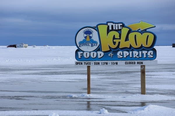 A sign reads "The Igloo, food & spirits"