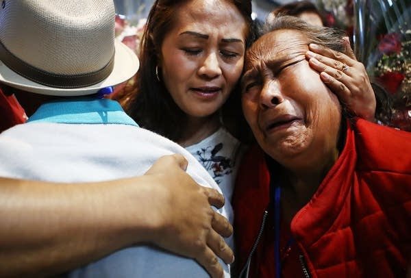 Members of the Miraflores and Linares families hug at a 2019 reunification event in Los Angeles for Mexican families separated from loved ones living in the U.S. due to migration. 