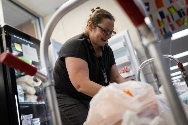 A woman sorts supplies