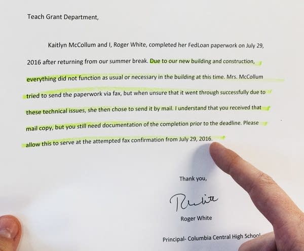 Kaitlyn McCollum points to a letter written by her principal.