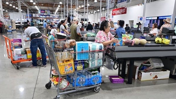 Consumer spending rises at a slower pace