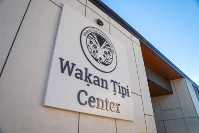 The sign on a building reads "Wakan Tipi Center."