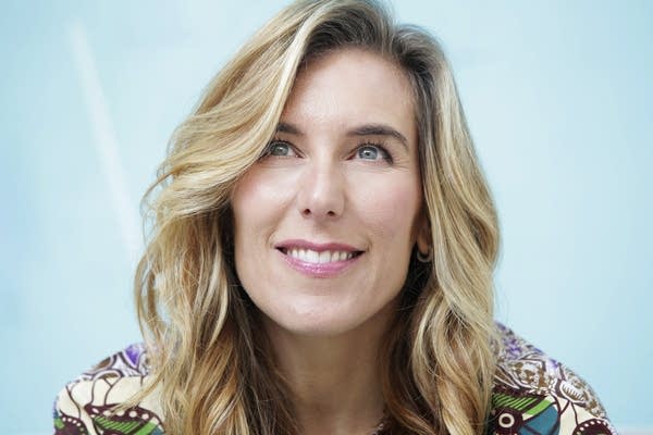 A woman poses for a portrait