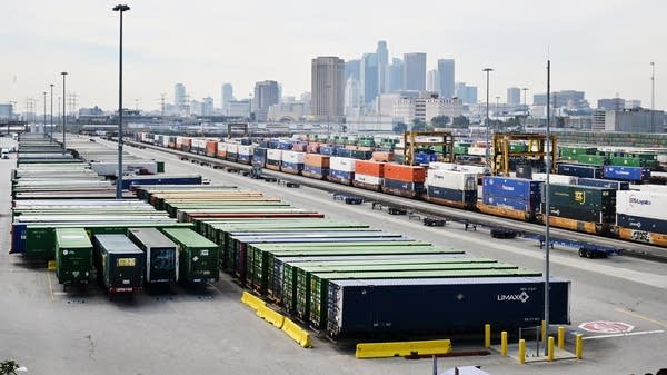 Imported goods in shipping containers in Los Angeles. Continued tariffs could mean less spending from businesses, drops in hiring, and less specialization in what U.S. businesses are good at.
