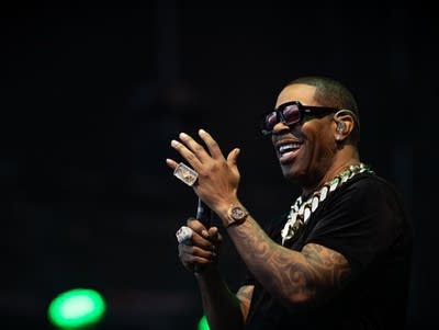 Busta Rhymes smiling on stage