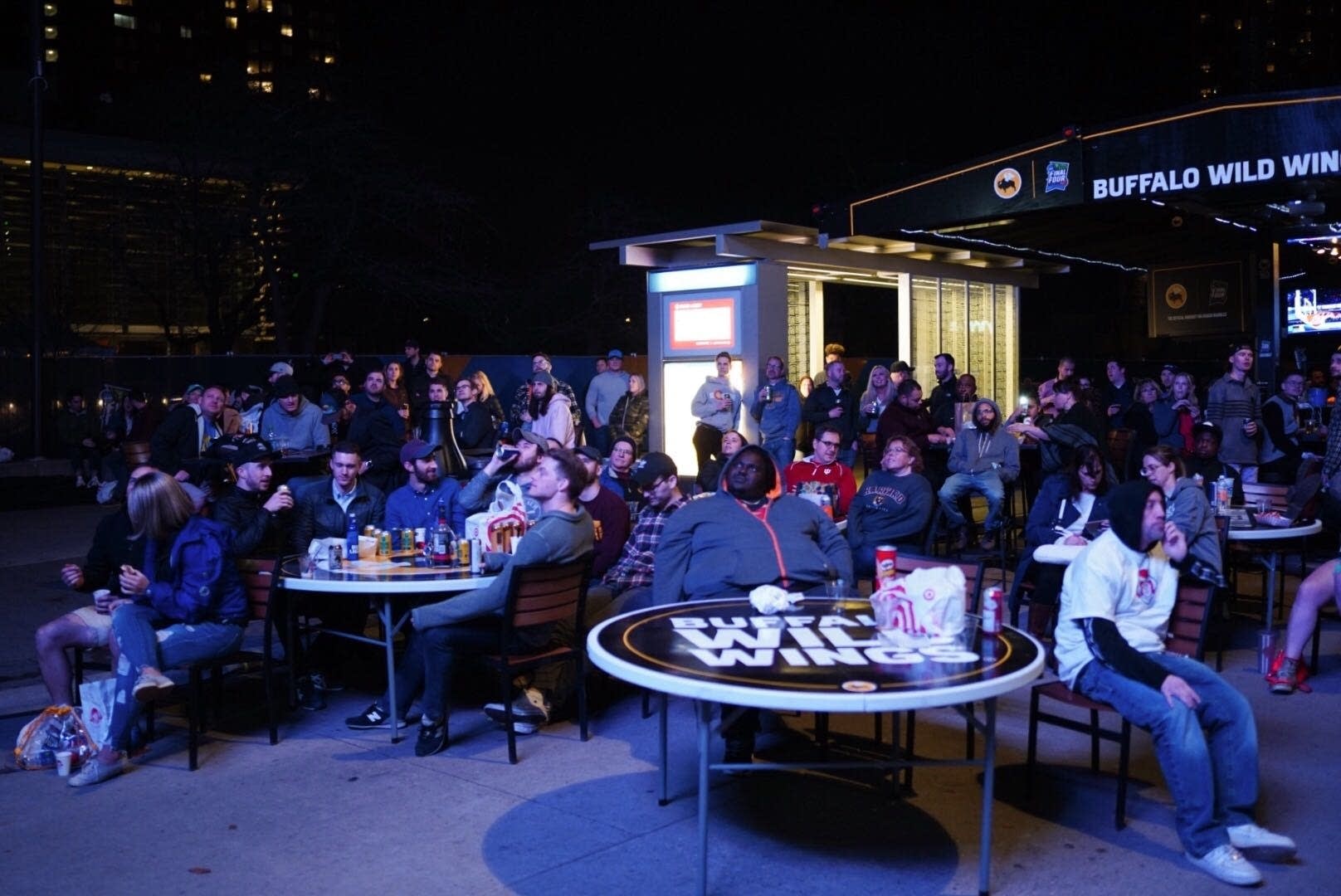 Fans watch the NCAA men's basketball championship game on Nicollet Mall