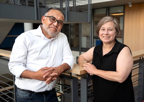 a man and a woman posing for a portrait