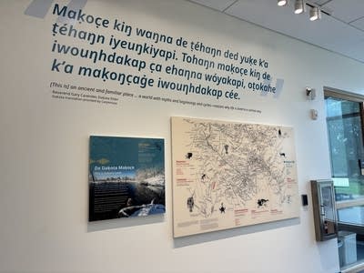 A map of Dakota sacred sites hangs on a white wall.