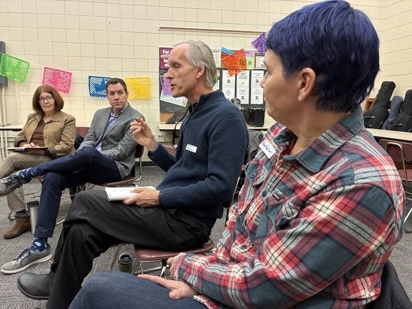 a woman listening while a person speaks