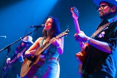 A A band performing onstage at a music venue