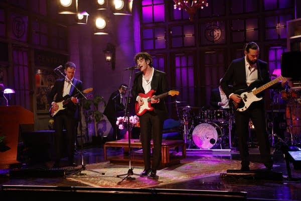 A band performing on a television soundstage