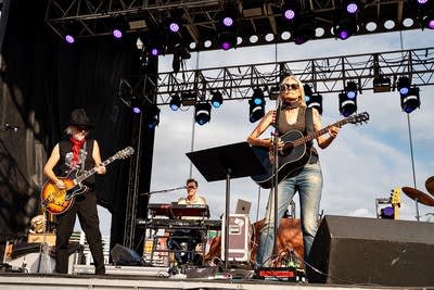 A band performing on an outdoor stage