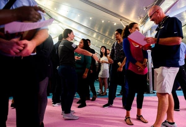 Amazon recruiters give advice to job seekers at an Amazon Career Day event,