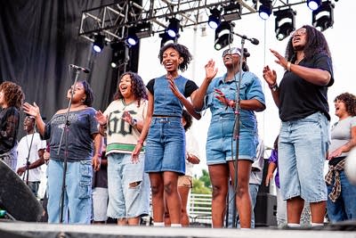 Known MPLS performing on an outdoor stage.