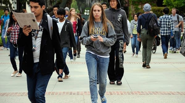 Students walk across the campus of UCLA on April 23, 2012 in Los Angeles, California. New data shows a decline in students meeting the mark for 6 year college completion rate.