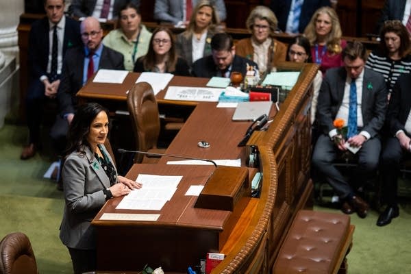 A woman speaks at the lectern