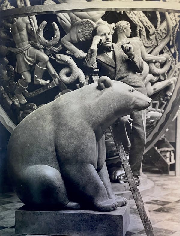 man with model bear