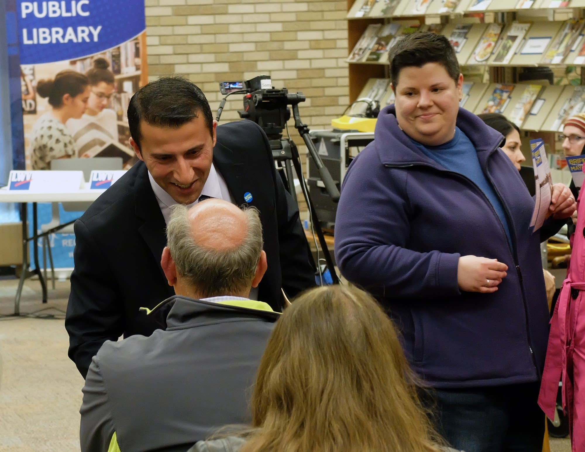 Moorhead mayoral candidate Newzad Brifki greets an attendee.