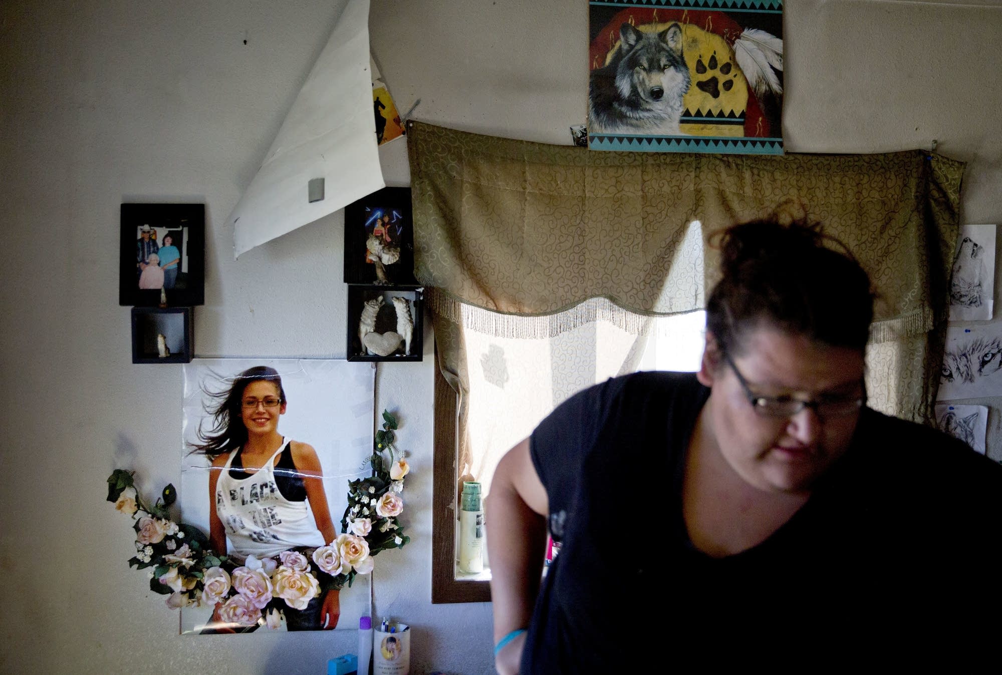 A poster of Ashley HeavyRunner Loring hangs on the wall.