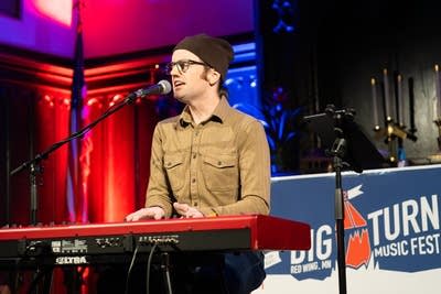 Man playing keyboard and singing