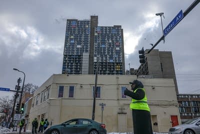Volunteers stand watch around the Cedar-Riverside Plaza 