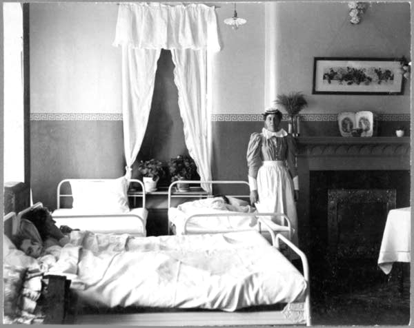 Nurse with patient in Fergus Falls State Hospital, approximately 1900.