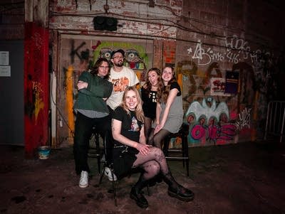 Five members of Sallyforth pose for a photo.