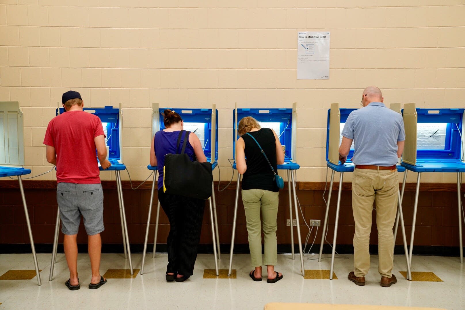 people vote at the pershing park recreation center - before you post a voting selfie on instagram check your state laws