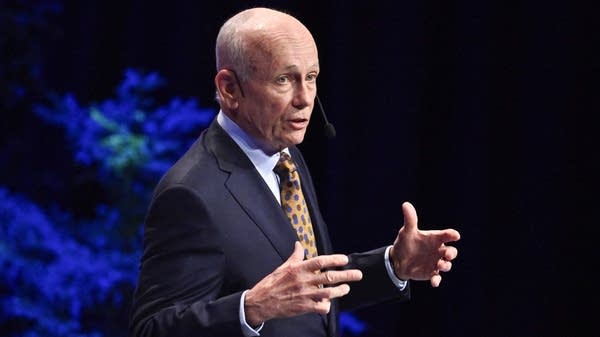 Above, Canadian economist Peter Howitt gives a lecture in economic science at Stockholm University on Monday.