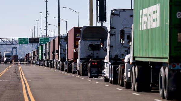 Addressing trucker wait times at warehouses and ports could alleviate some supply chain kinks and improve driver satisfaction. Above, trucks lined up at the Port of Los Angeles in November 2021.