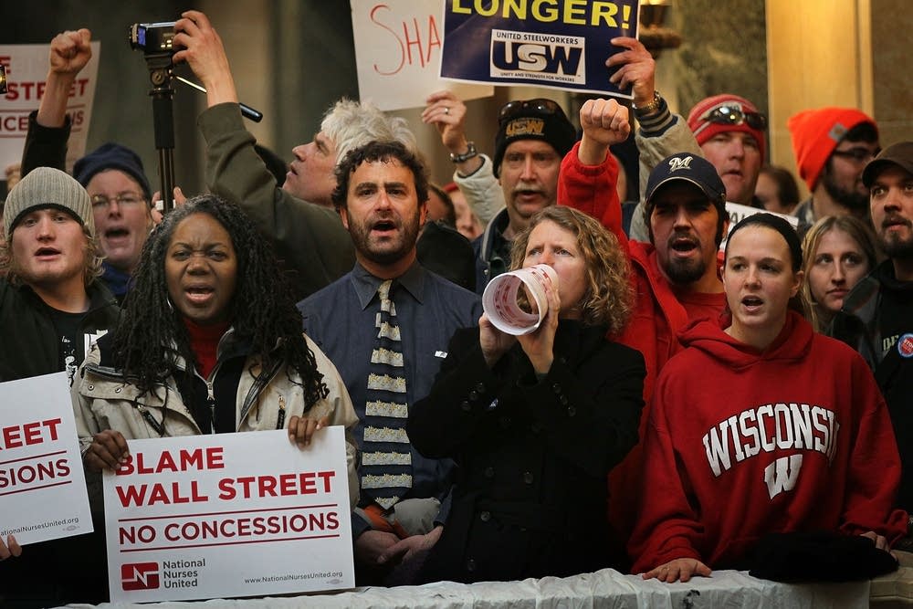 Protestors yell