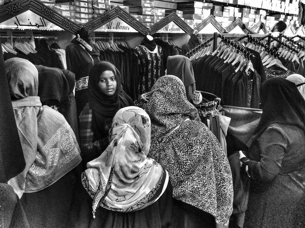 Muslim women try on clothes ahead of Eid