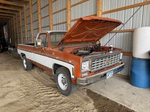 pickup truck with its hood popped open