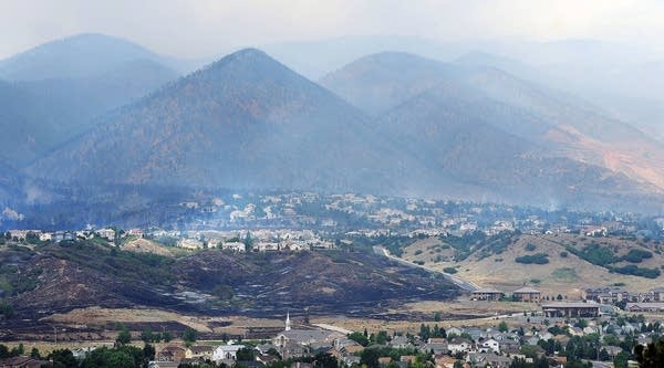 Smoke from the Waldo Canyon fire drapes the foothills of Colorado Springs, Colo. 