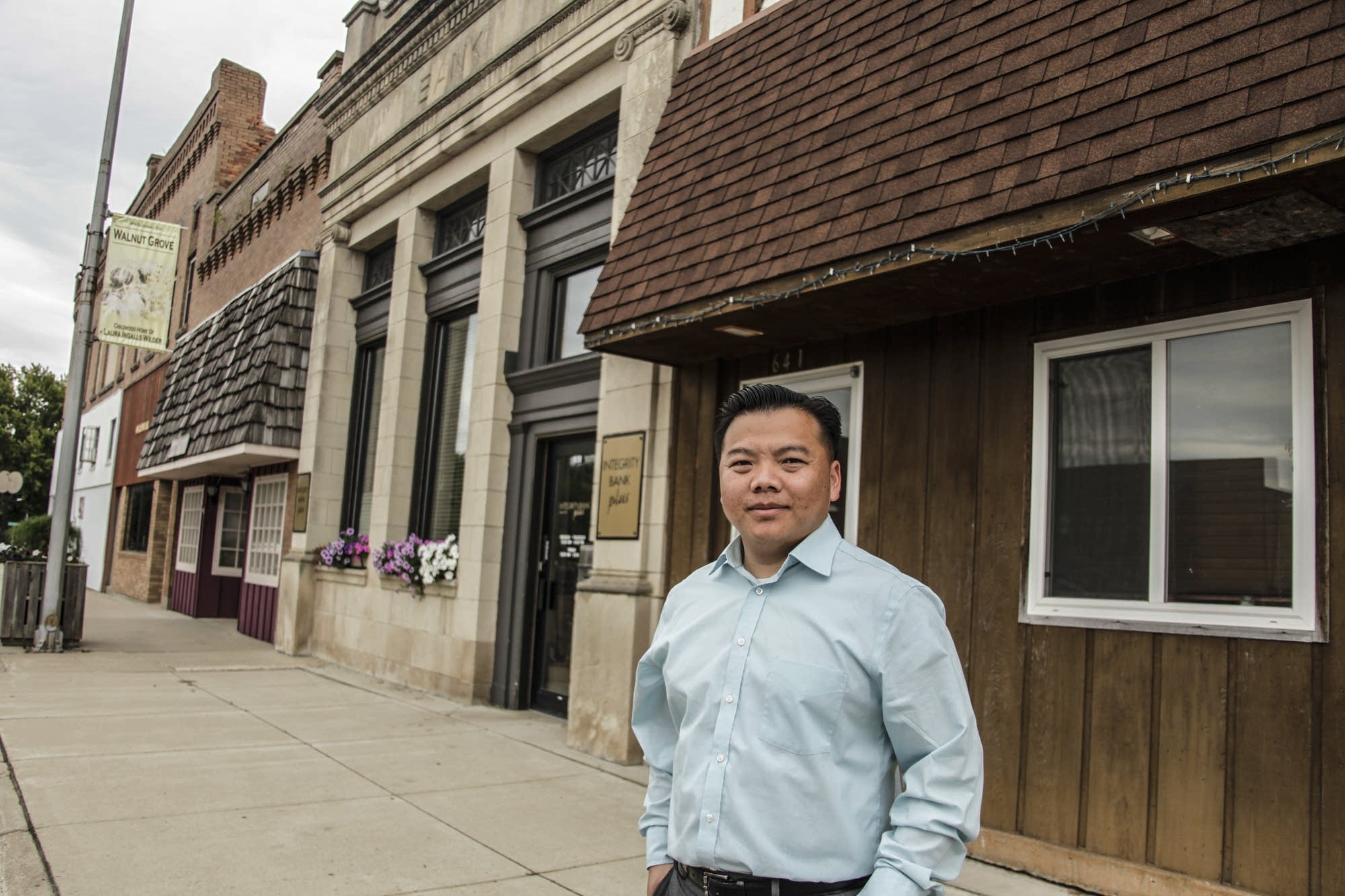 Xiong Yang stands on the main street in Walnut Grove.