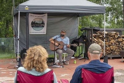 Eli Gardiner performing under tent