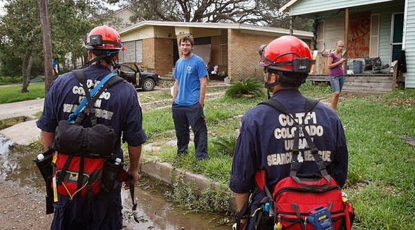 Members of FEMA's Colorado Urban Search and Rescue team check on residents who did not evacuate before Hurricane Ike's arrival September 14, 2008 in Galveston, Texas.
