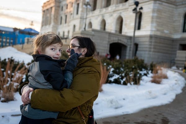 A mom holds her son
