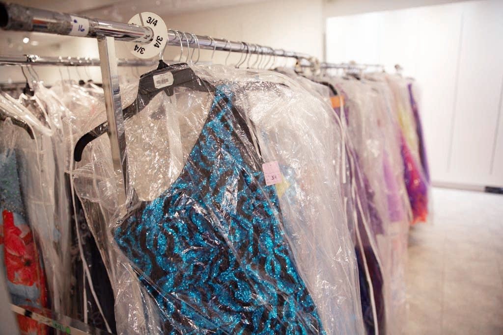 Some of the 3,000 prom dresses are hung in Southdale Center.