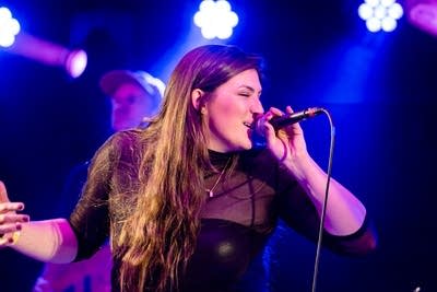 Woman singing on stage