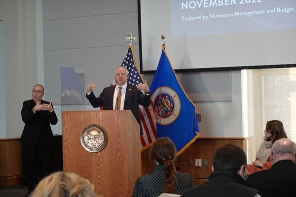 Person stands at podium