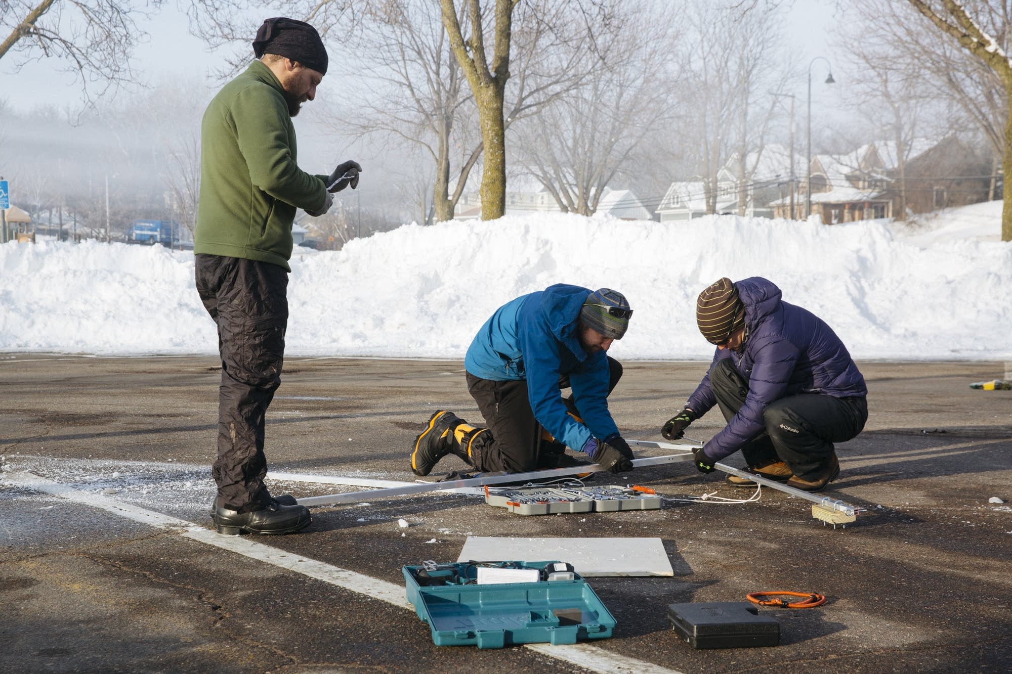 Researchers assemble equipment in the parking lot of Surfside Park