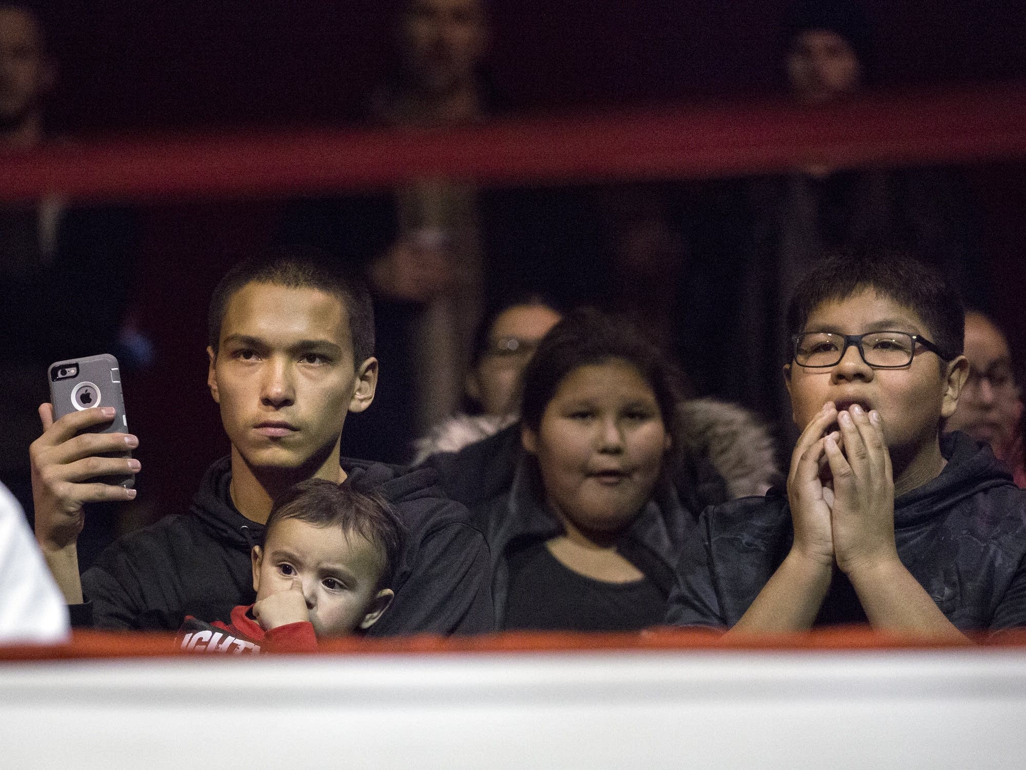 Antonio Varney, left, watches the fights from ringside.